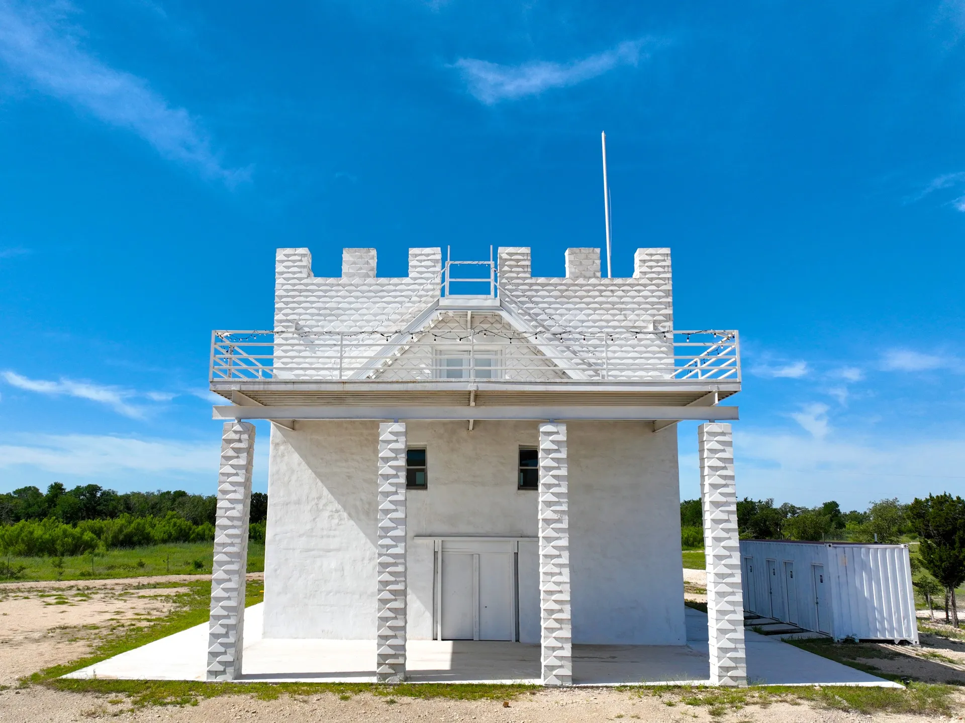 The white crenellated castle building on the Sunset Ridge property